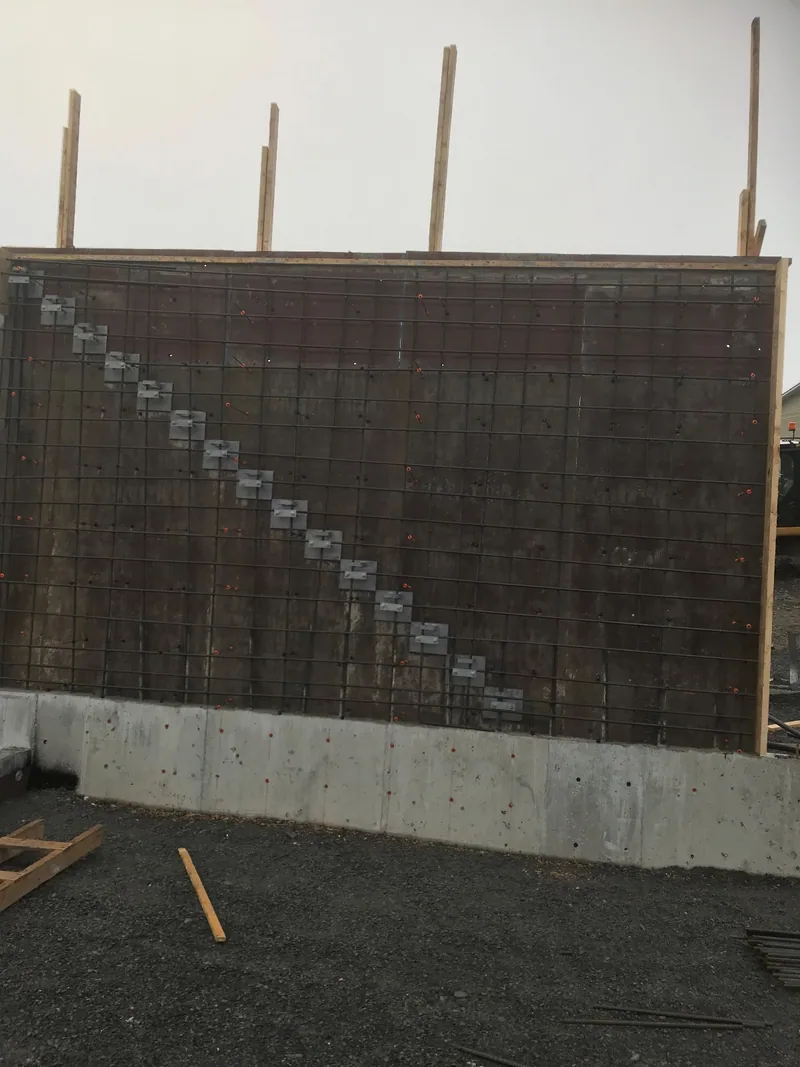 A grid of installed rebar tied in place before a concrete pour.